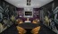 Resident lounge at Broadstone 2Thirty apartments in Atlanta, GA, featuring tables with chairs and floral wallpaper.