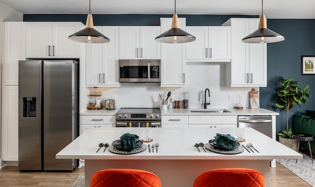 Model kitchen at Broadstone 2Thirty apartments in Atlanta, GA, featuring a kitchen island with counter seating. Model kitchen at Broadstone 2Thirty apartments in Atlanta, GA, featuring a kitchen island with counter seating.