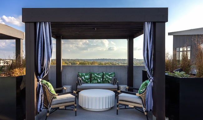 Rooftop lounge at Broadstone 2Thirty apartments in Atlanta, GA, featuring outdoor furniture and view of the forest. Rooftop lounge at Broadstone 2Thirty apartments in Atlanta, GA, featuring outdoor furniture and view of the forest.
