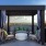 Rooftop lounge at Broadstone 2Thirty apartments in Atlanta, GA, featuring outdoor furniture and view of the forest.